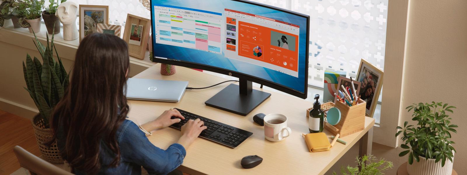 Person working on a desktop computer