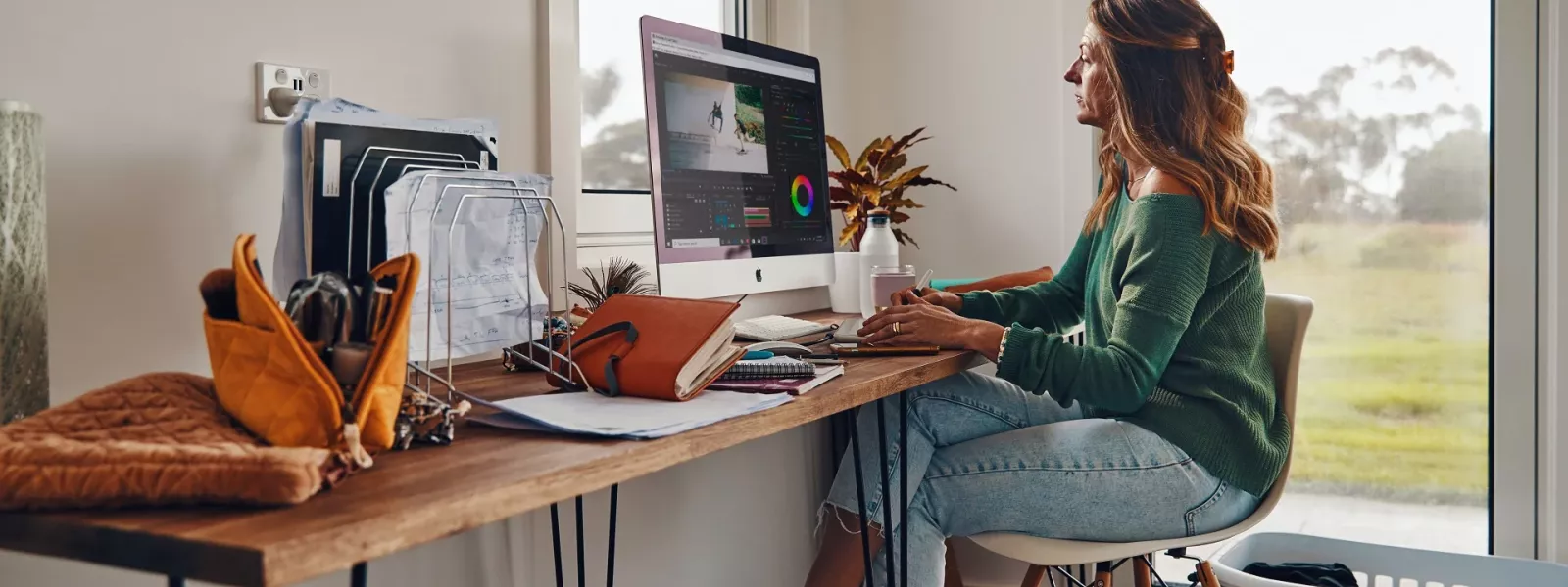 Woman sitting at desk at home