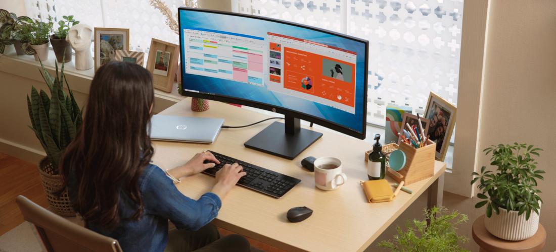 Person working on a desktop computer